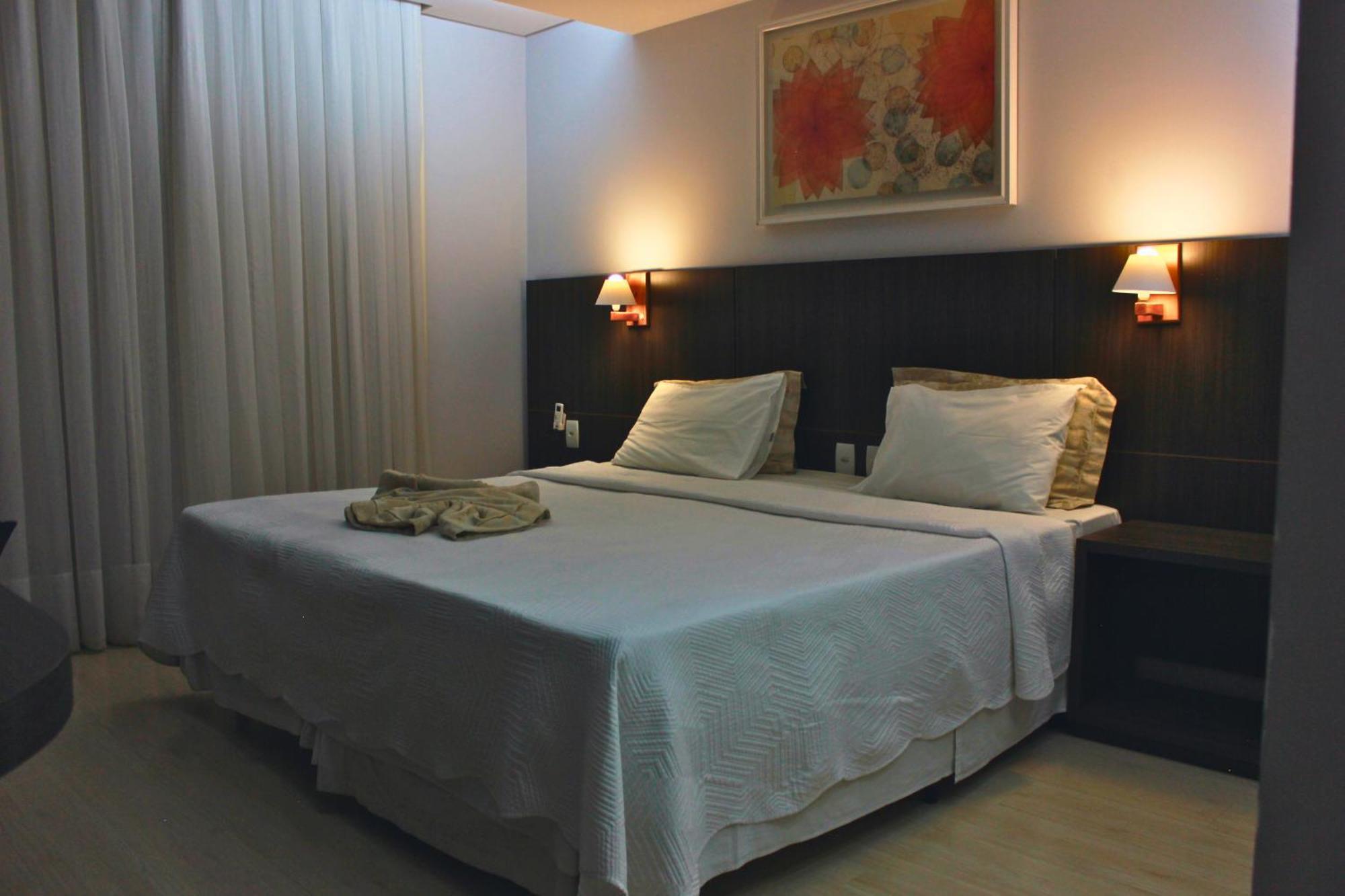 Gontijo Inn Hotel Itajubá Buitenkant foto A bedroom